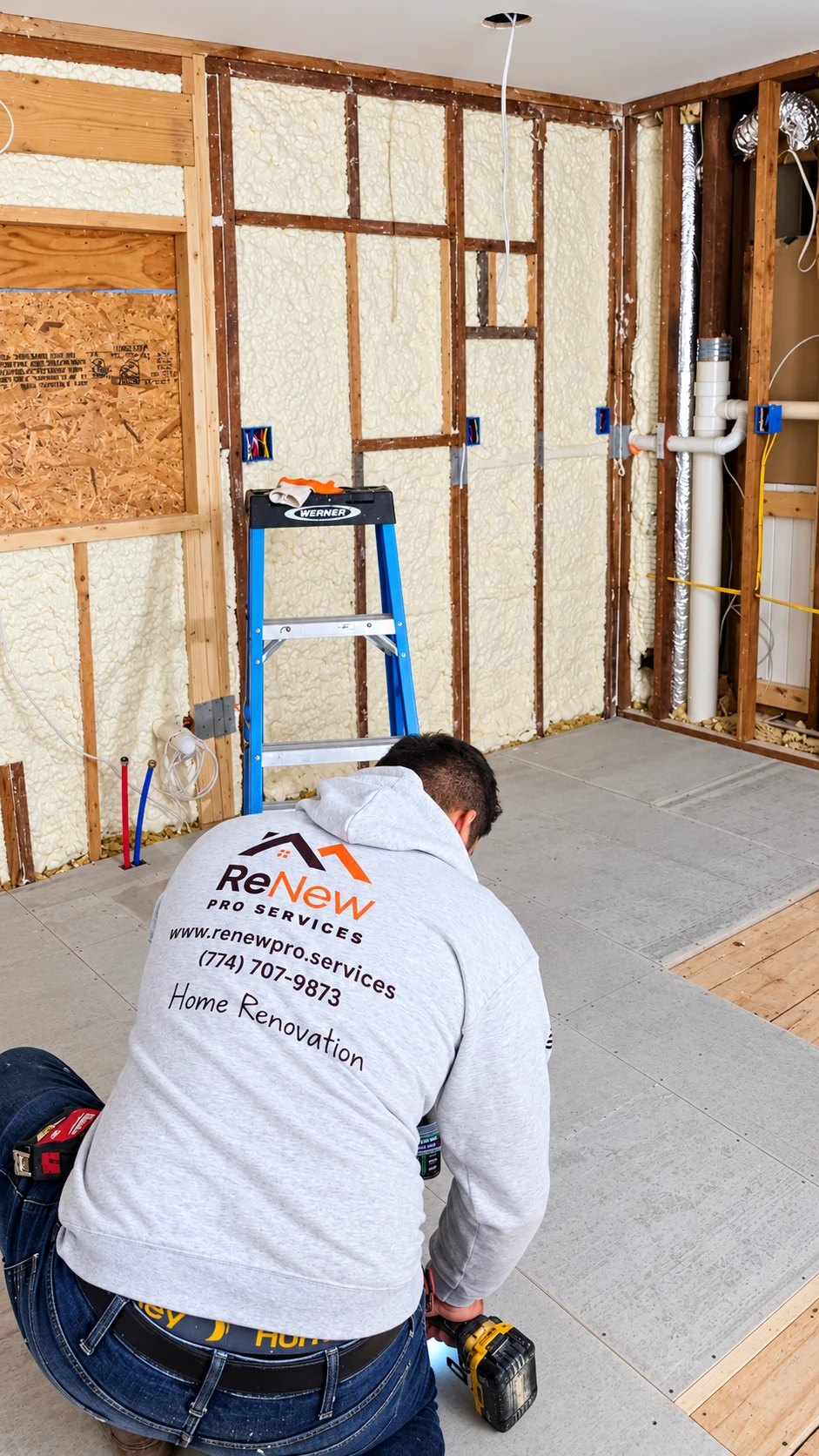 Renew Pro Services contractor installing subfloor panels in a gutted room with spray-foam insulated walls