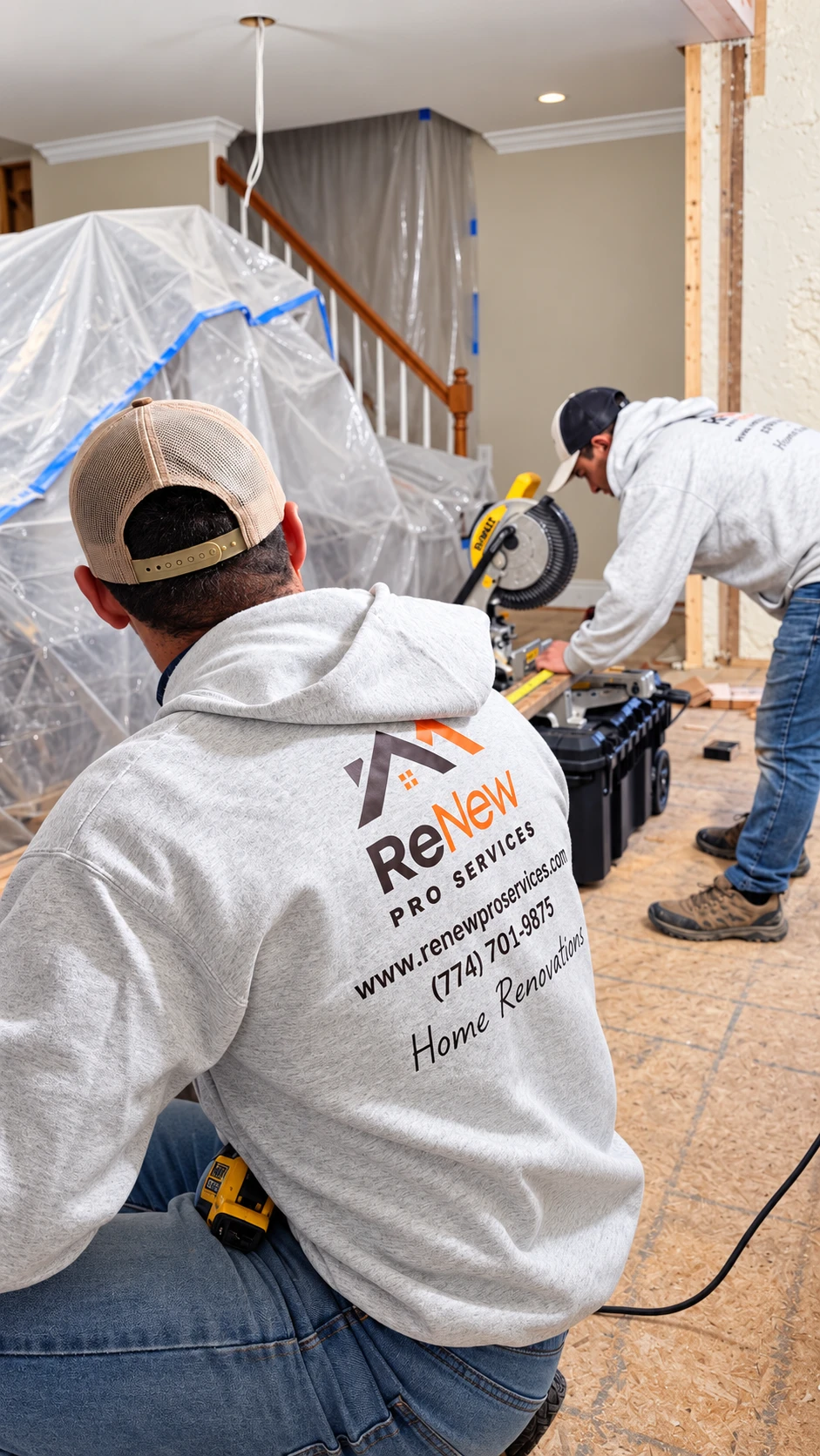 Renew Pro Services carpenter cutting trim on a miter saw behind dust barriers